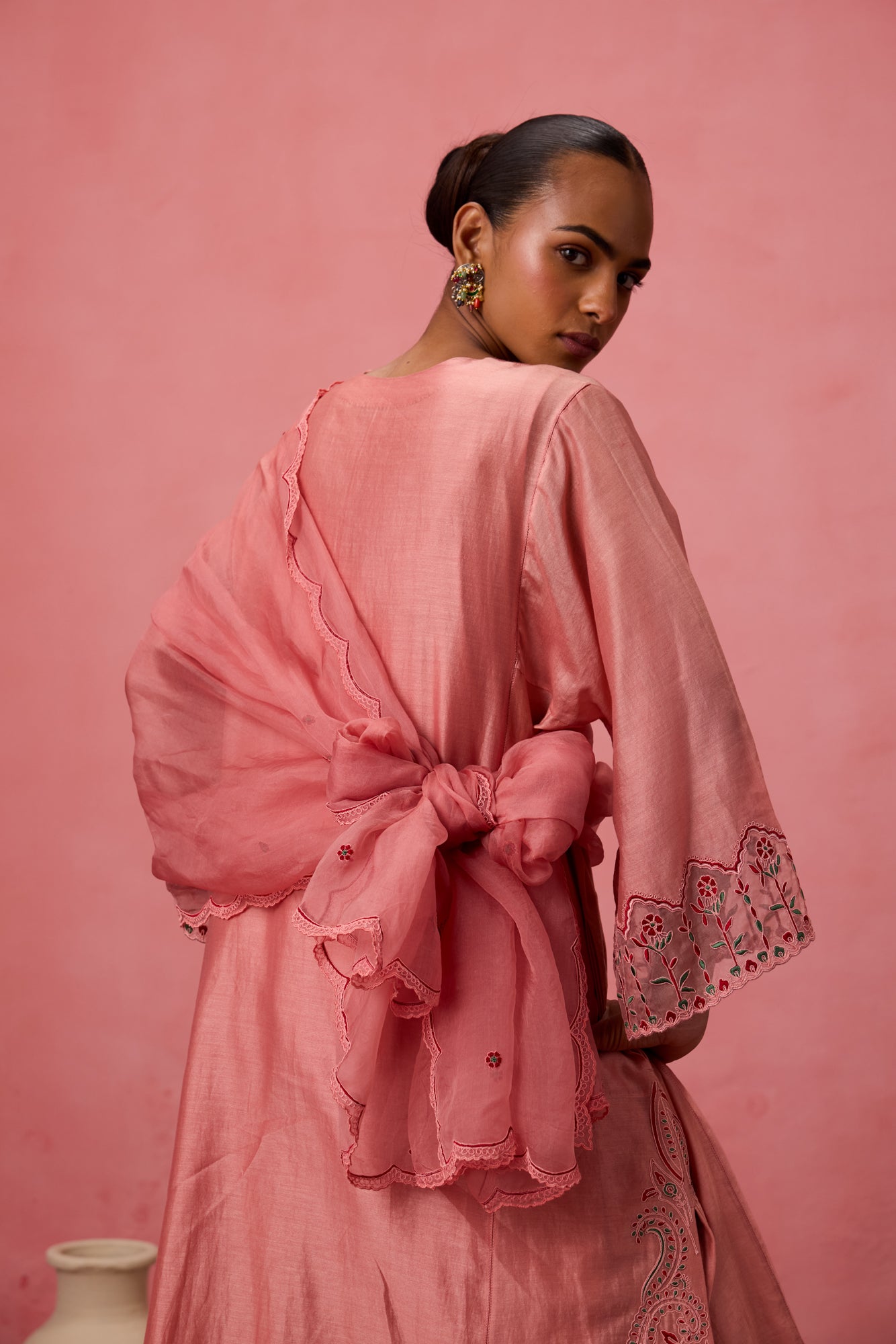 Peach chanderi embroidered kurta with embellished border on sleeves paired with an organic cotton slip pant & organza dupatta