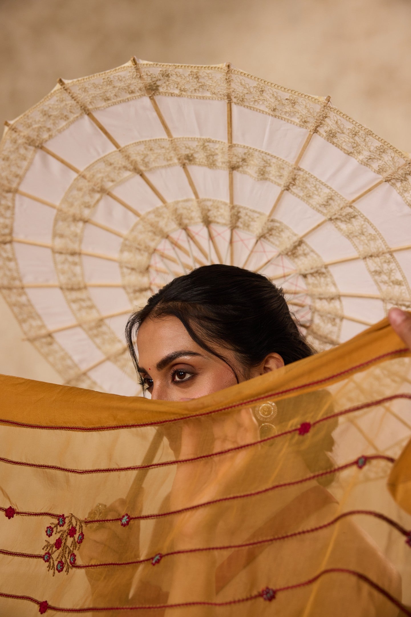 Mustard embroidered organza saree  paired with unstitched & unembroidered blouse fabric